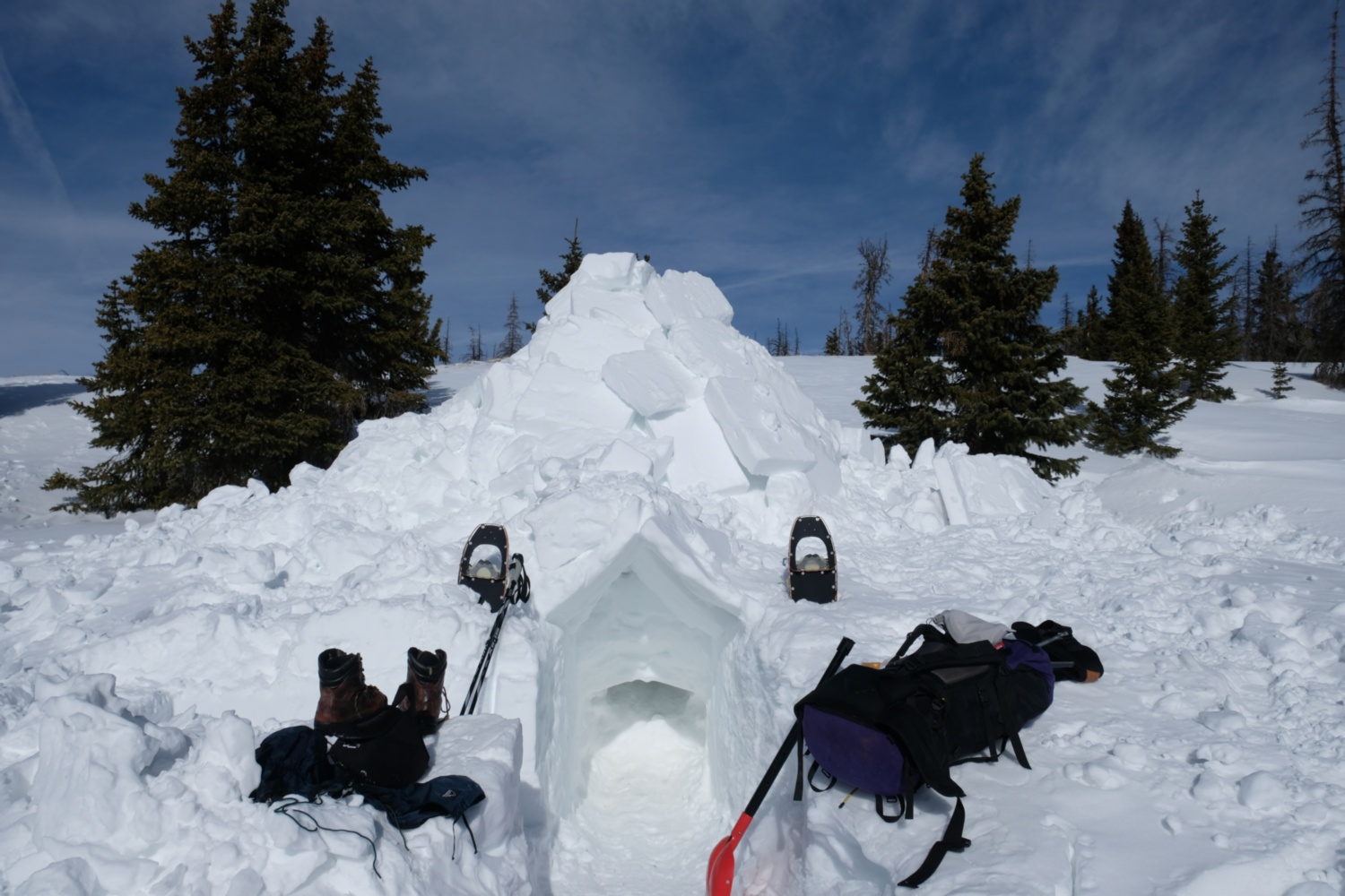 Outside the igloo, packing up to leave.