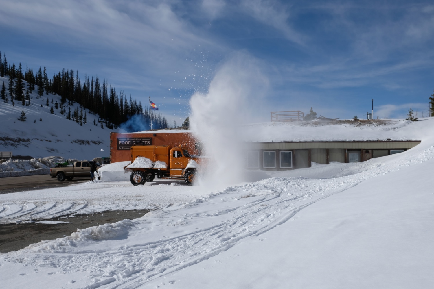 A large snow blower truck.