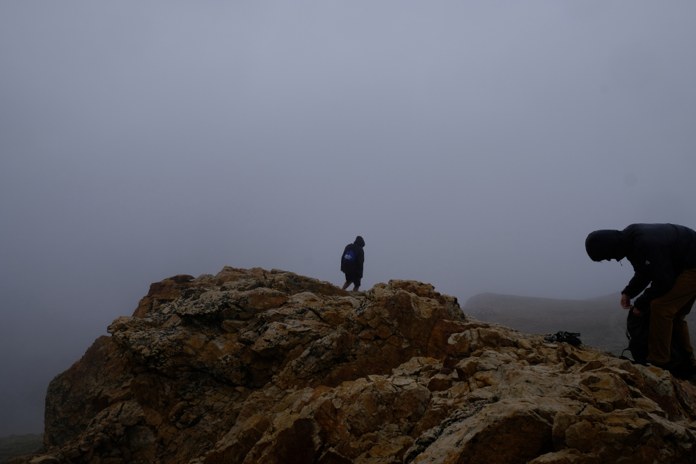 People on the summit of Mt Belford in the fog & rain