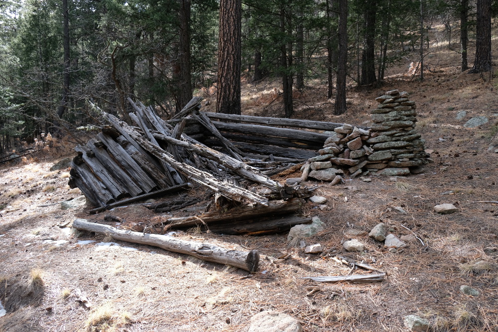 An old collapsed log cabin.