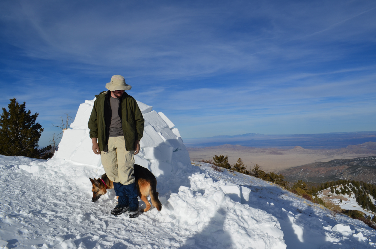 David, the visiting dog, and the igloo with the Rio Grande valley in the background.