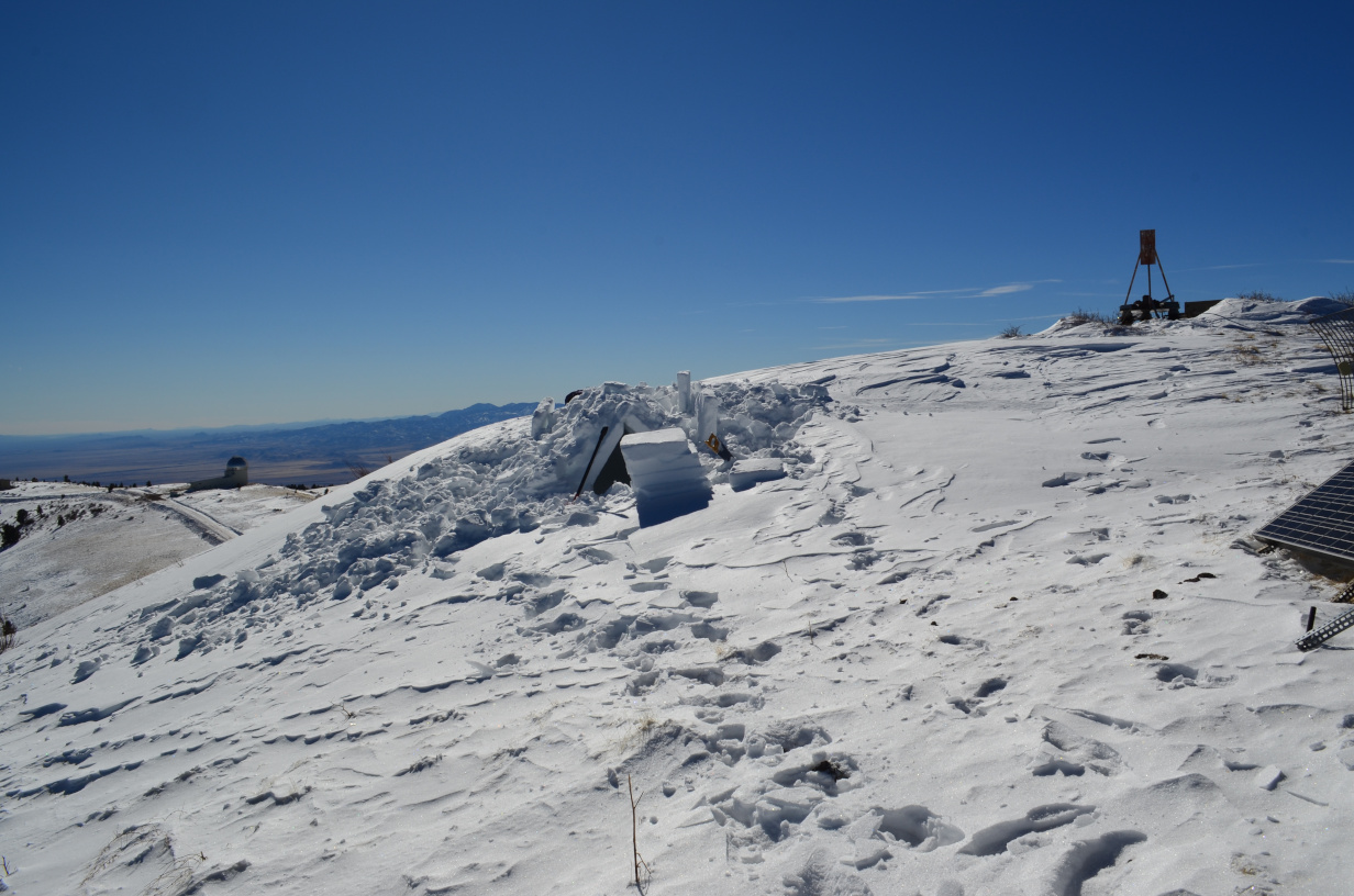 The snow house construction with Magdalena Ridge Observatory in the background.
