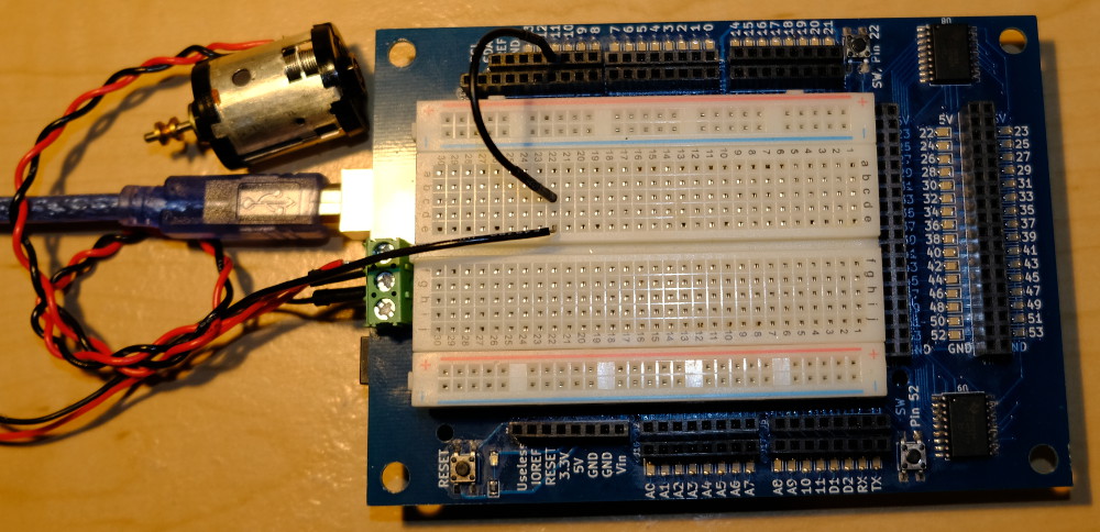 A photo of the board and a small DC motor