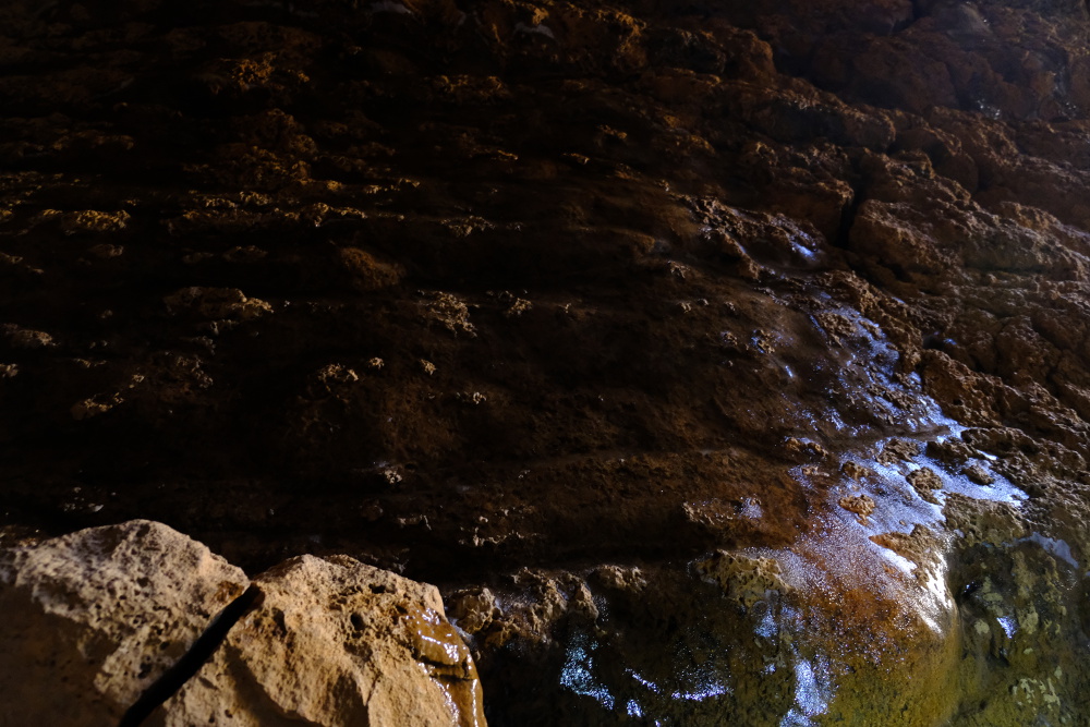 Ice covering a sloping wall in the cave.