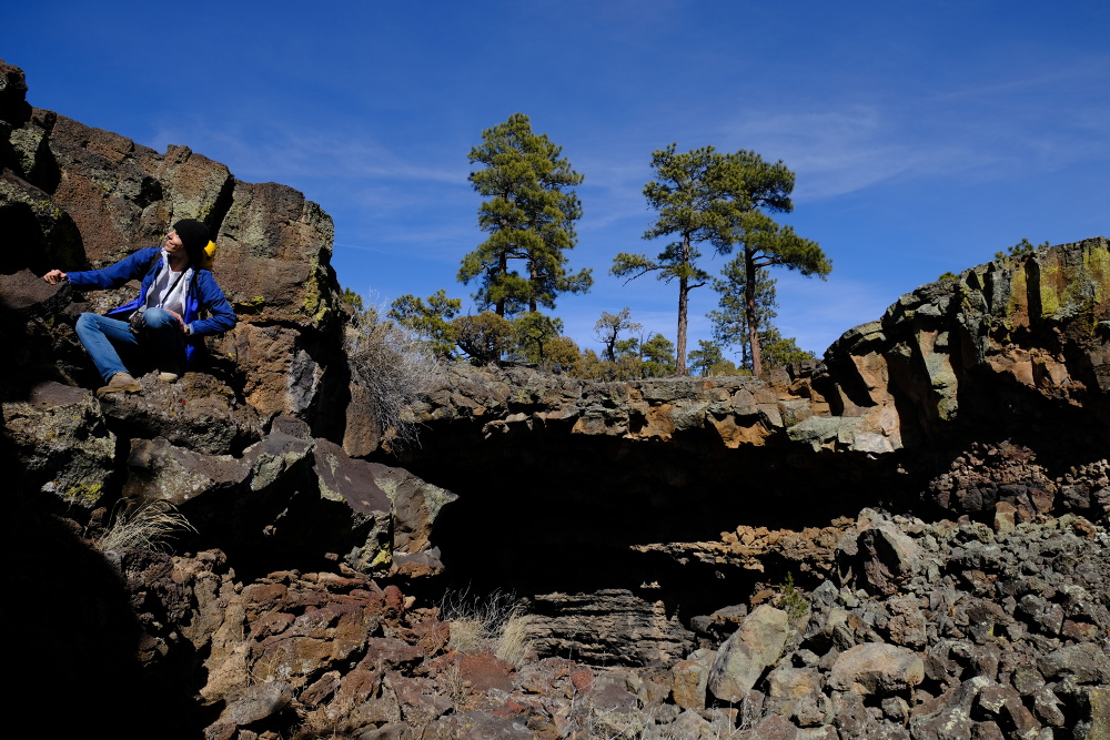 A caver headed down the climb into the collapsed lava tube.