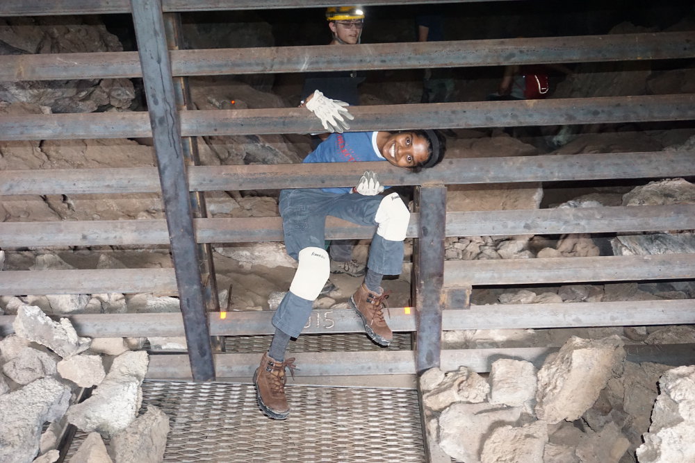 Eshani inspecting the Junction Cave gate.