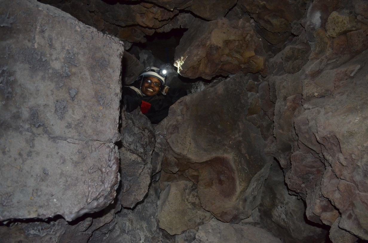 Eshani looking down from a passage above.