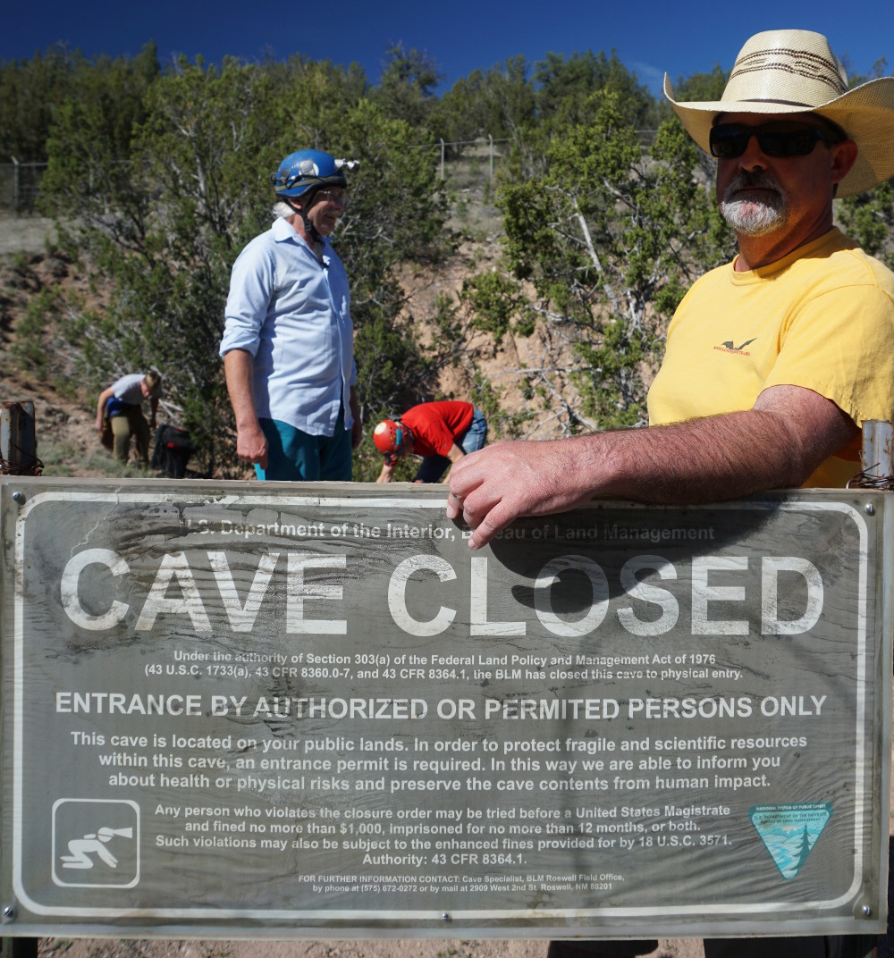 Knutt at the closed entry to Fort Stanton Cave