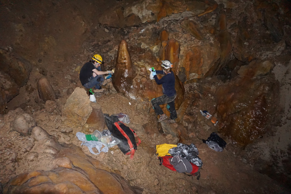 Jen and Connor cleaning a large formation.