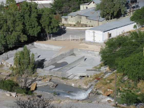 Water apparently being pumped out of the mine.