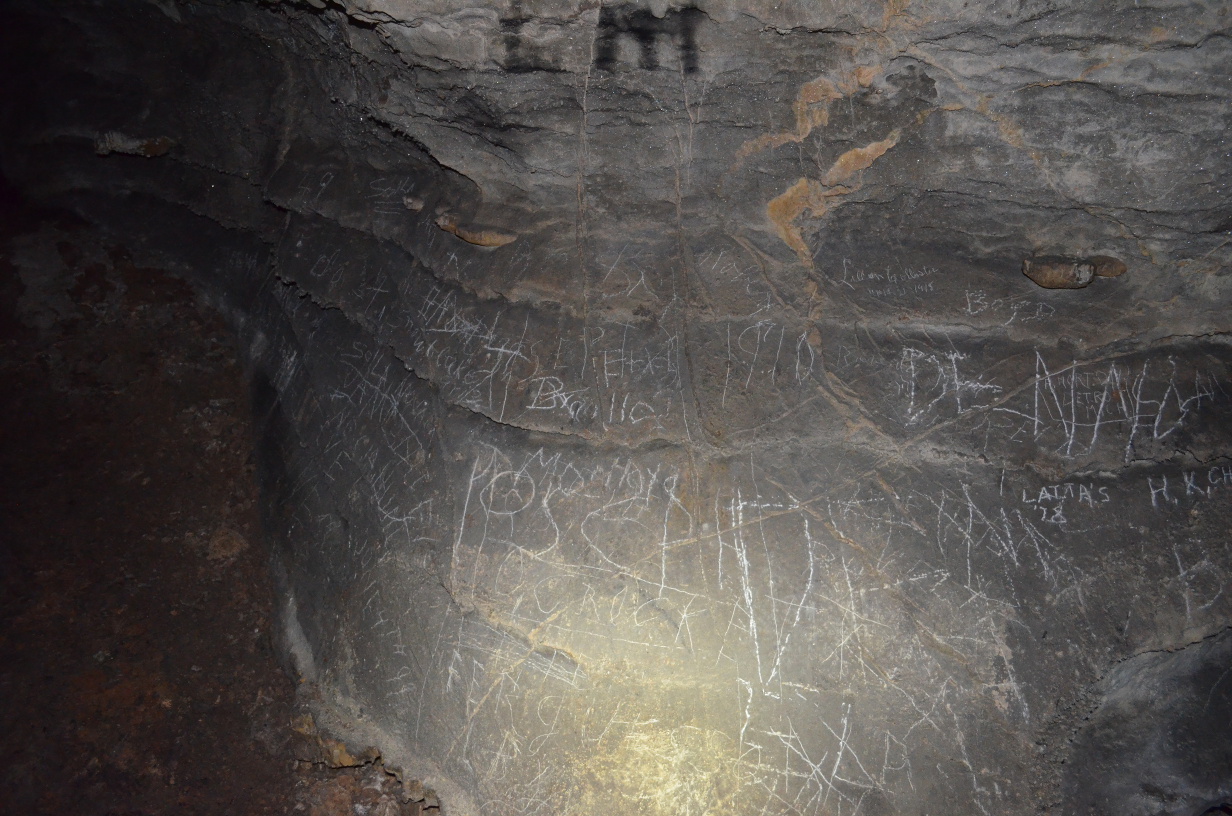 Some graffiti carved into the cave wall.