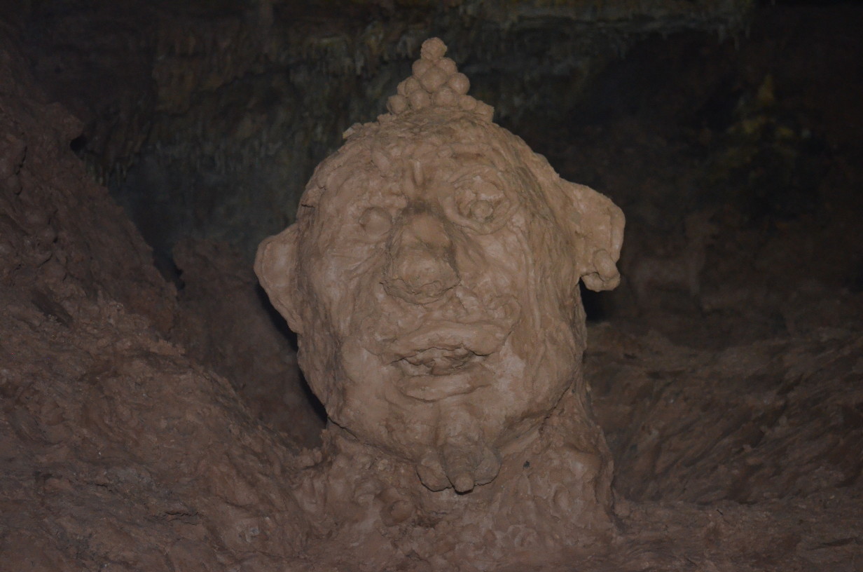 A large head sculpted out of mud