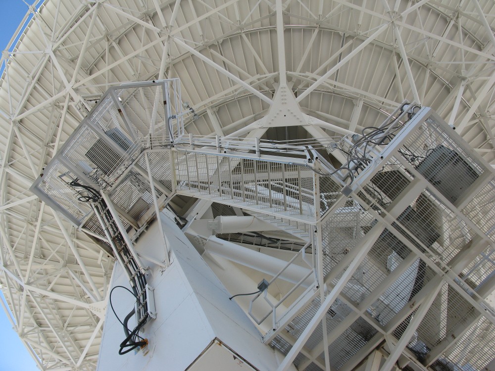 Looking up at a VLA dish.